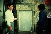 Making a rubbing of a historical stone tablet at Tin Hau Temple, Peng Chau, 18 January 1983.